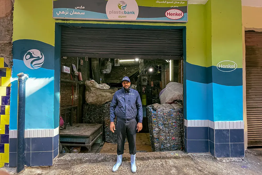 Worker posing at the entrance of a Plastic Bank Egypt collection center